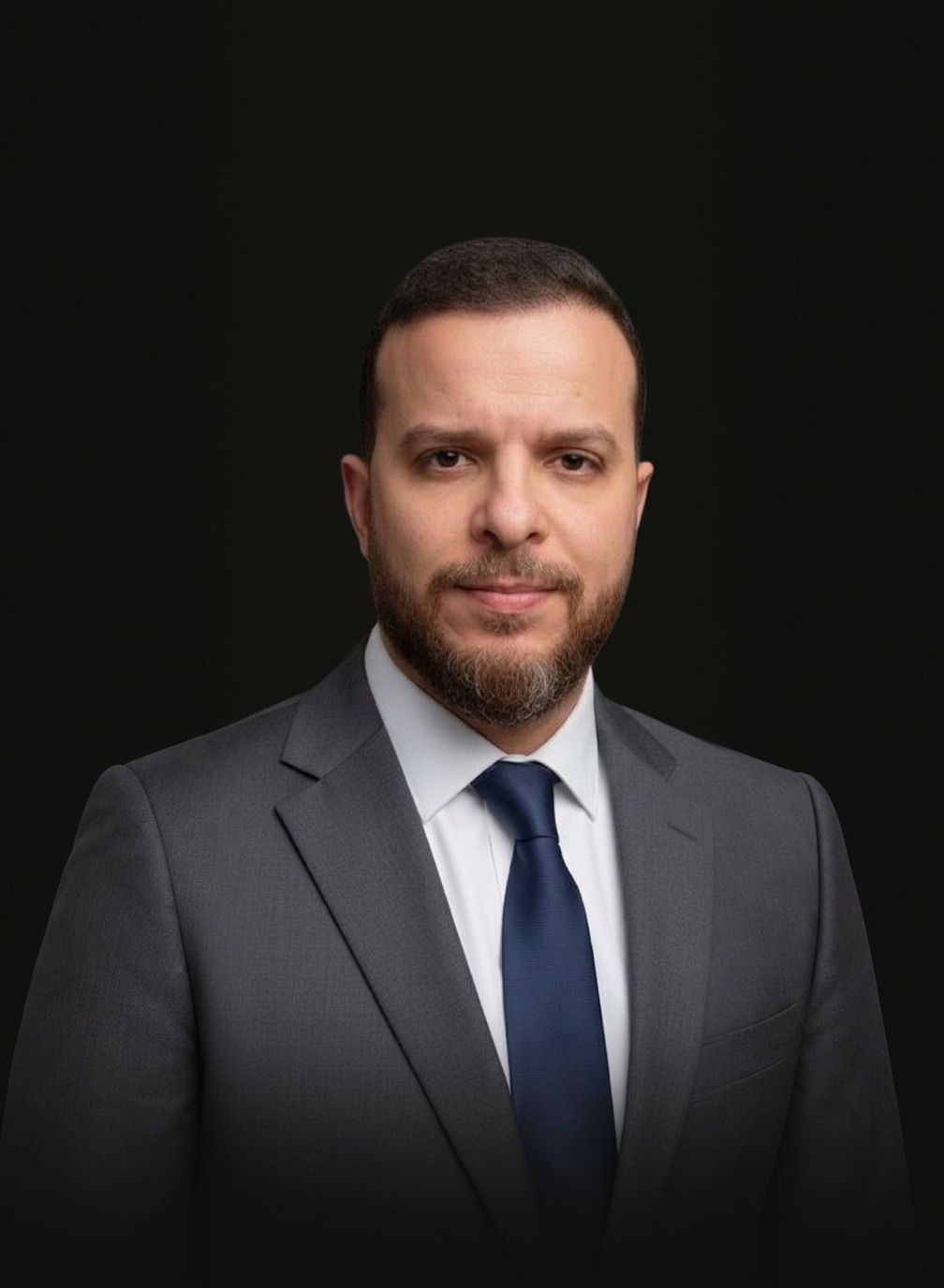 Mohammed Mansour in a gray suit